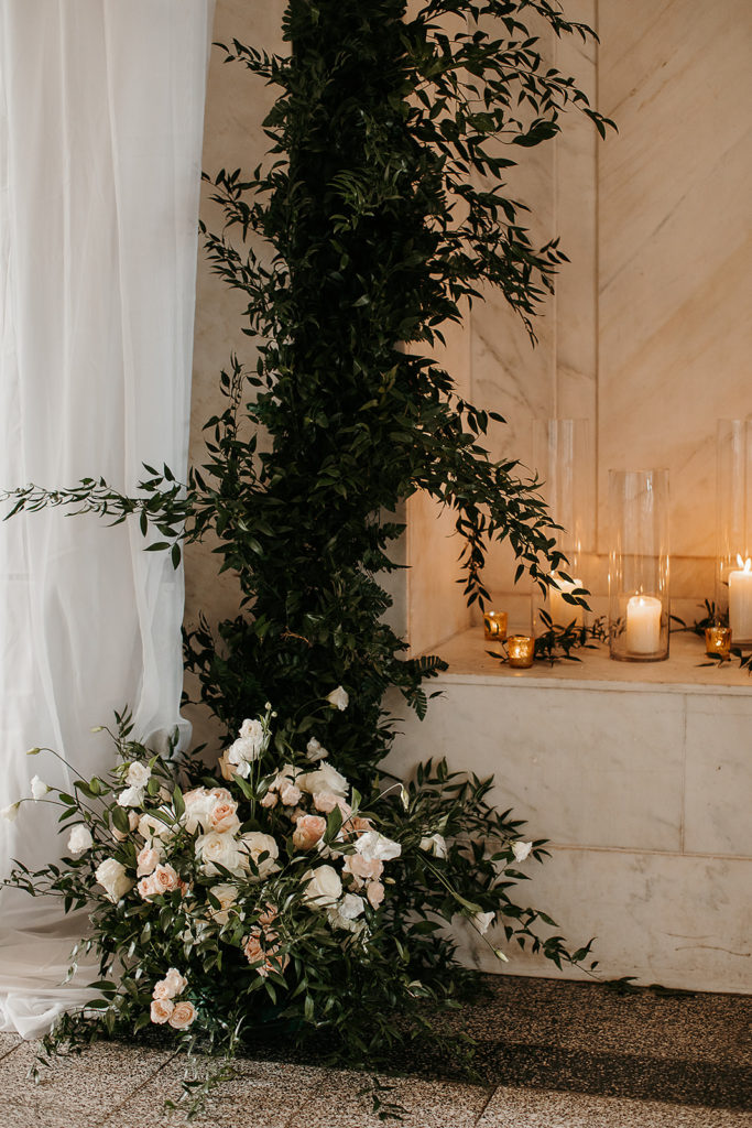 white and green elegant wedding florals setup at ceremony