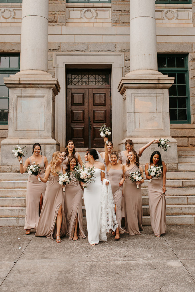 bridal party wedding photo in front of Dekalb County Courthouse