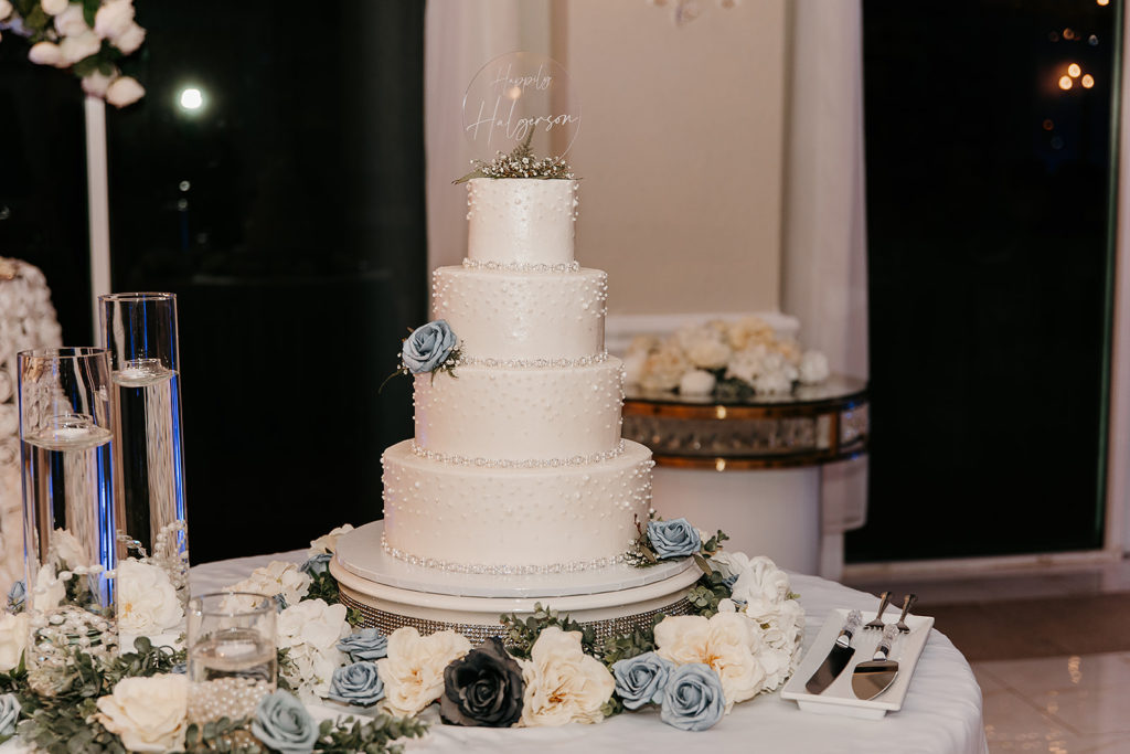 modern wedding cake with blue florals