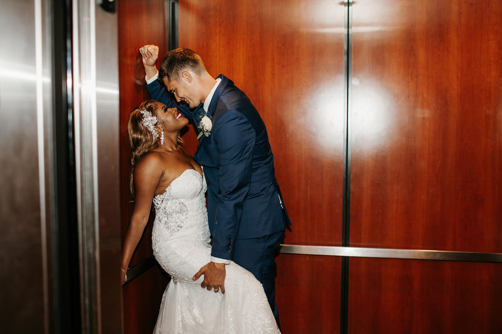 elevator photos with wedding couple