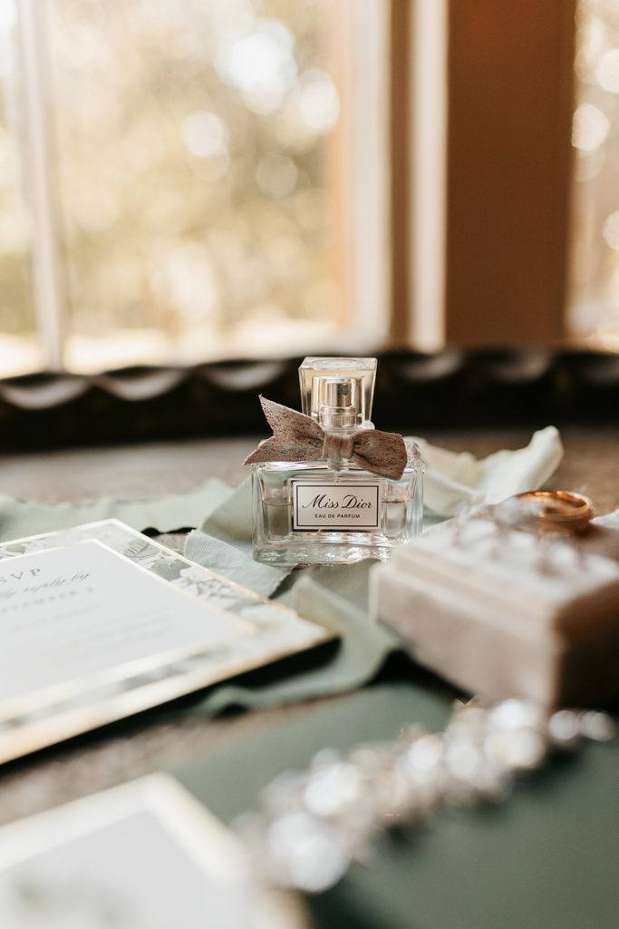 Wedding details of perfume and wedding invites