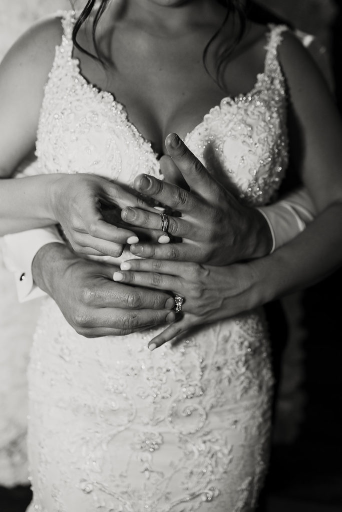 Black and white bride and groom wedding ring photo