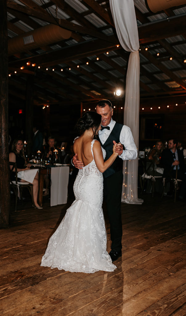 Bride dancing with father during wedding reception