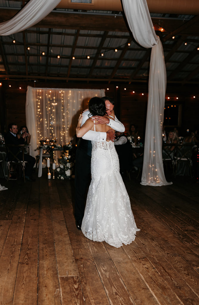 Bride dancing with father during wedding reception