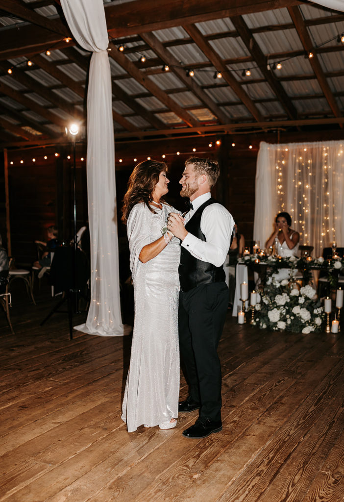 Groom and mothers first dance during wedding reception