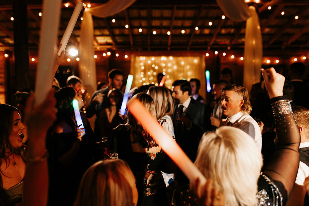 Wedding guests dancing during wedding reception