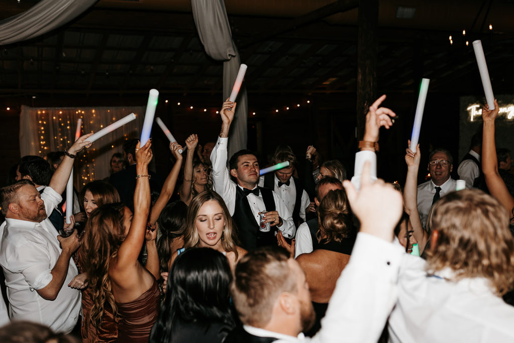 Wedding guests dancing during wedding reception